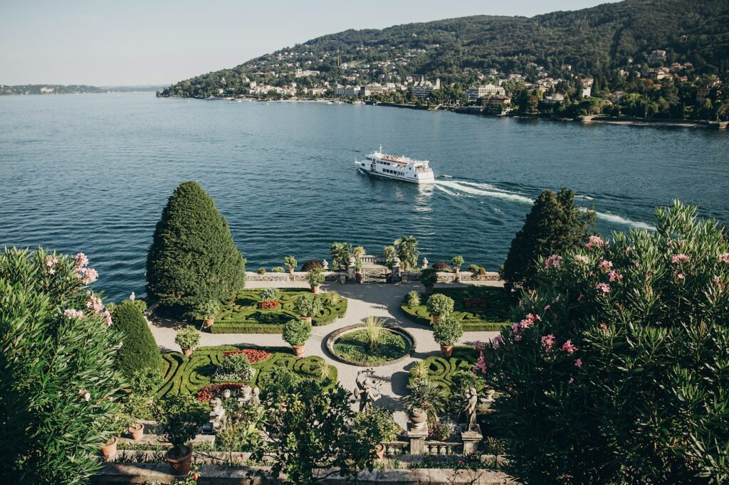 Beautiful view of stone landmarks and green terrace with flowers at Lago Maggiore