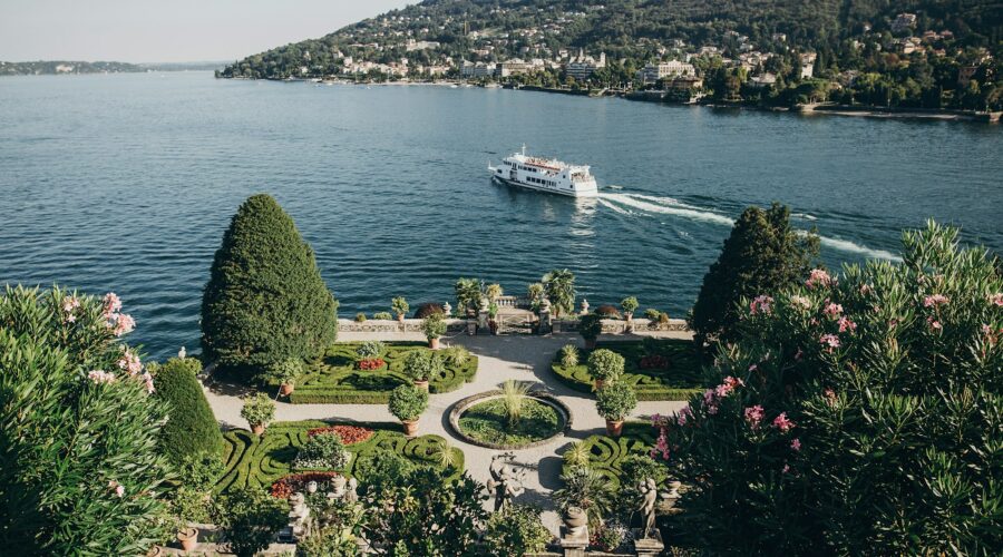 Beautiful view of stone landmarks and green terrace with flowers at Lago Maggiore