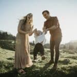 Happy family playing with little son on a hiking trip, Schwaegalp, Nesslau, Switzerland