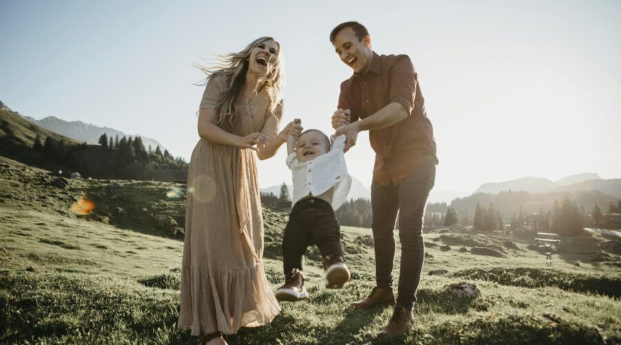Happy family playing with little son on a hiking trip, Schwaegalp, Nesslau, Switzerland