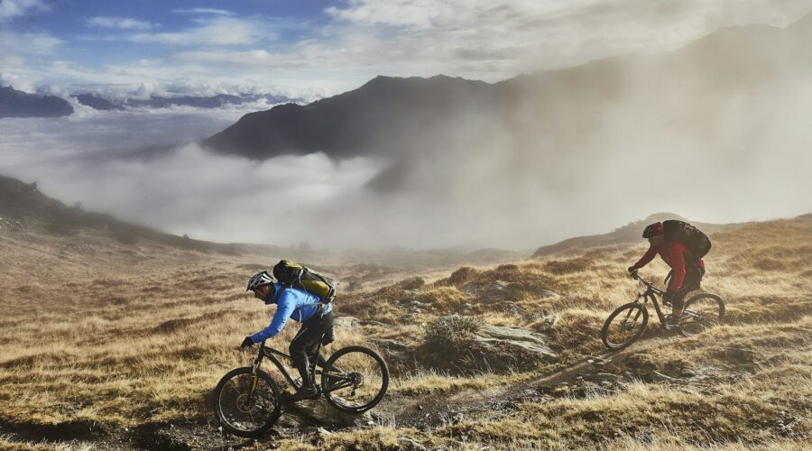 Mature men mountain biking, Valais, Switzerland