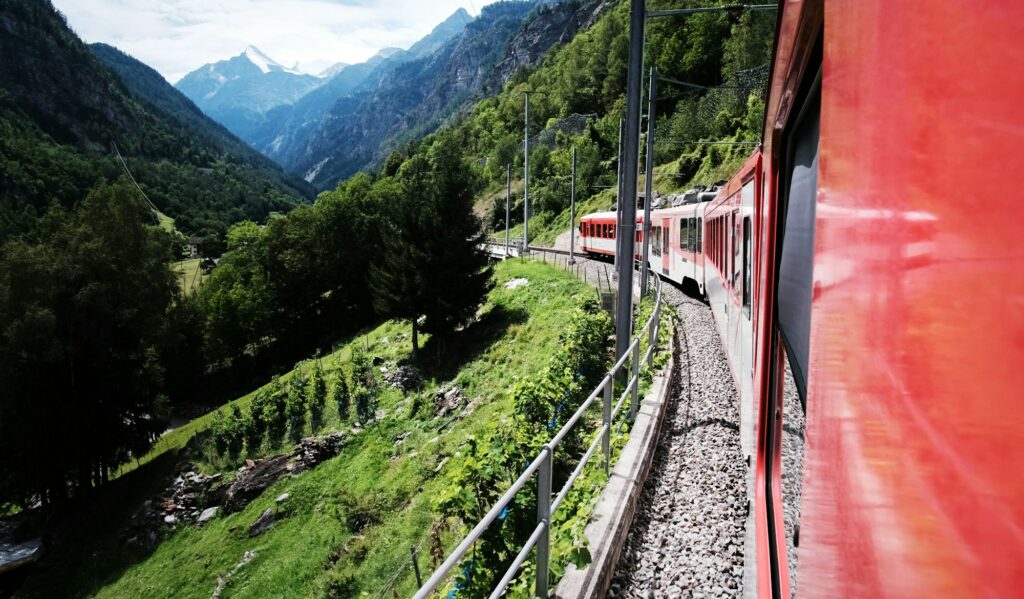 Swiss Train Passing By Amazing Alps Landscape